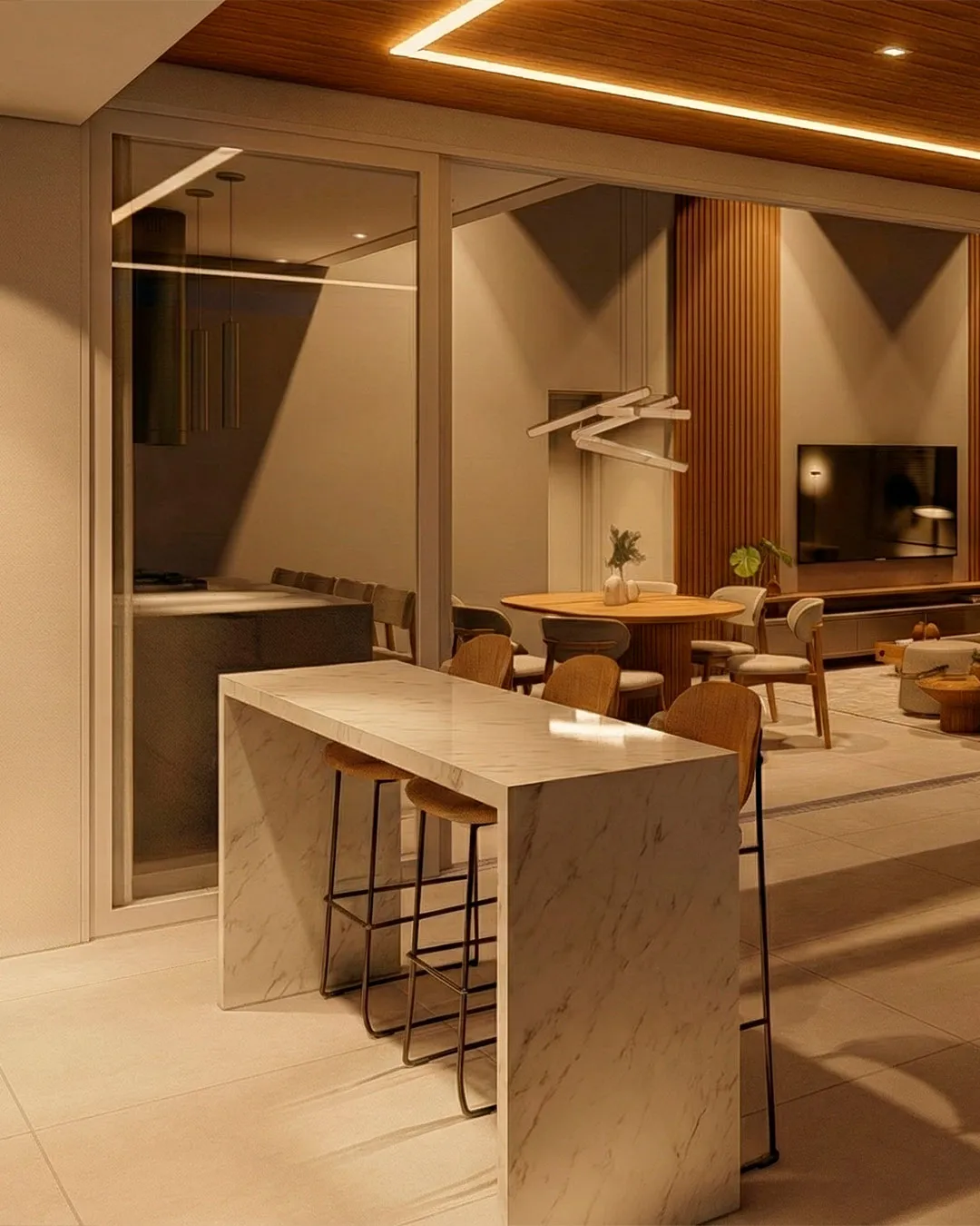 Sala integrada com bancada em mármore